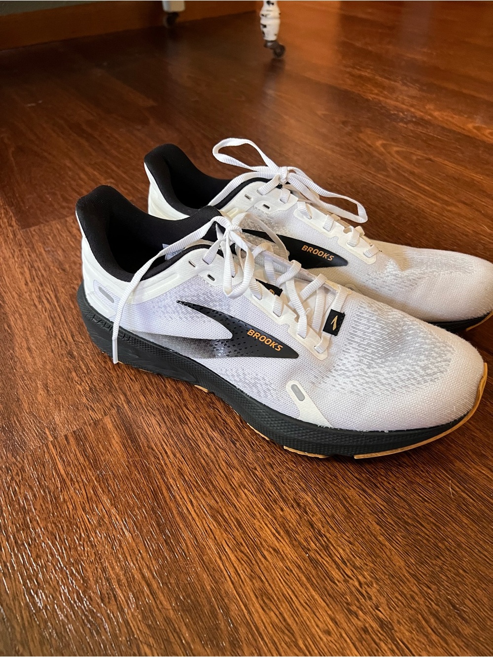 Brooks White and Black Running Sneakers with Gold Accents